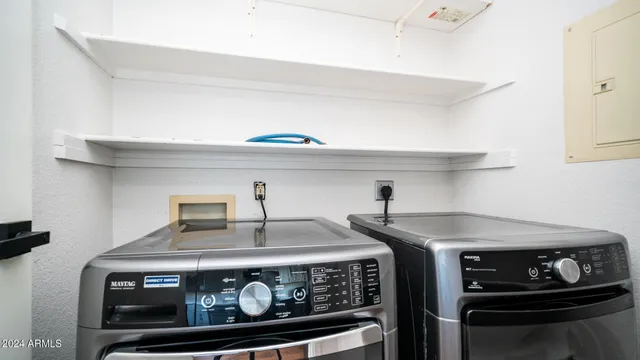a stove top oven sitting inside of a kitchen