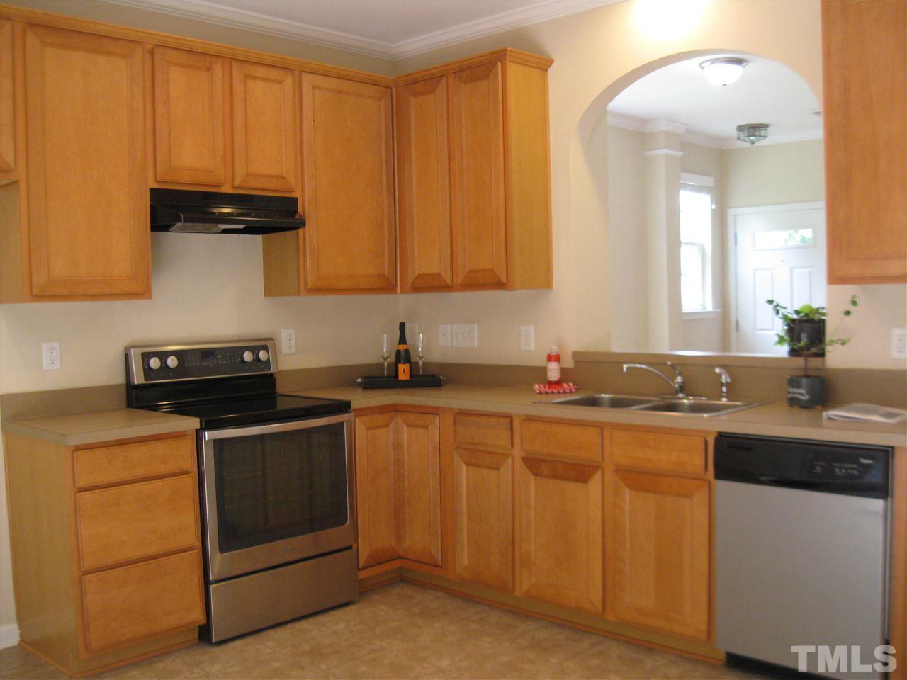 7677 Winners Edge Street Raleigh, NC 27617 - Photo 8 of 25 Stainless steel Whirlpool electric stove and Whirlpool ss dishwasher.