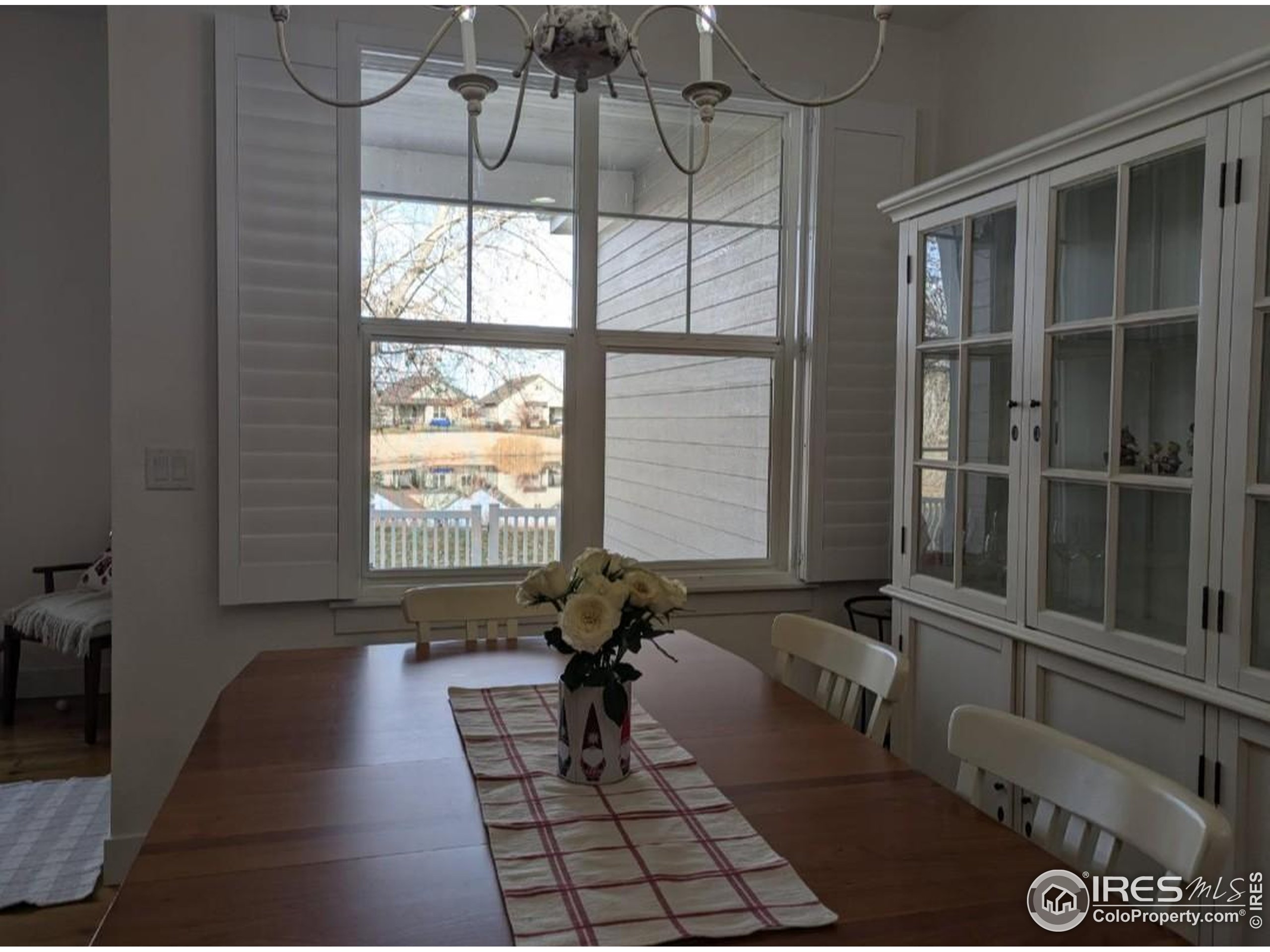 2172 Cape Hatteras Drive, Unit 2 Windsor, CO 80550 - Photo 12 of 46 a living room with furniture and a window