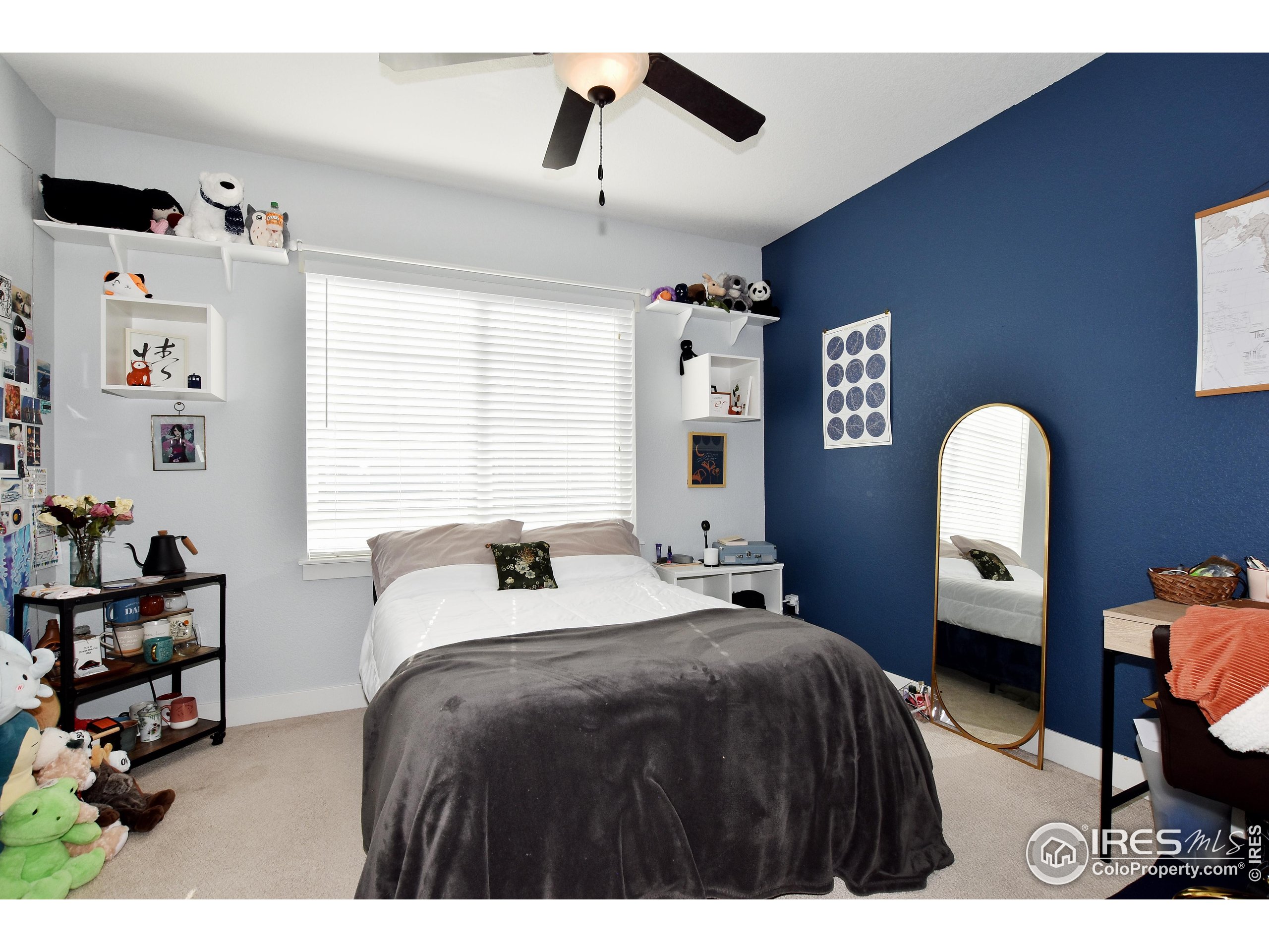 2172 Cape Hatteras Drive, Unit 2 Windsor, CO 80550 - Photo 29 of 46 a bedroom with a bed and a window