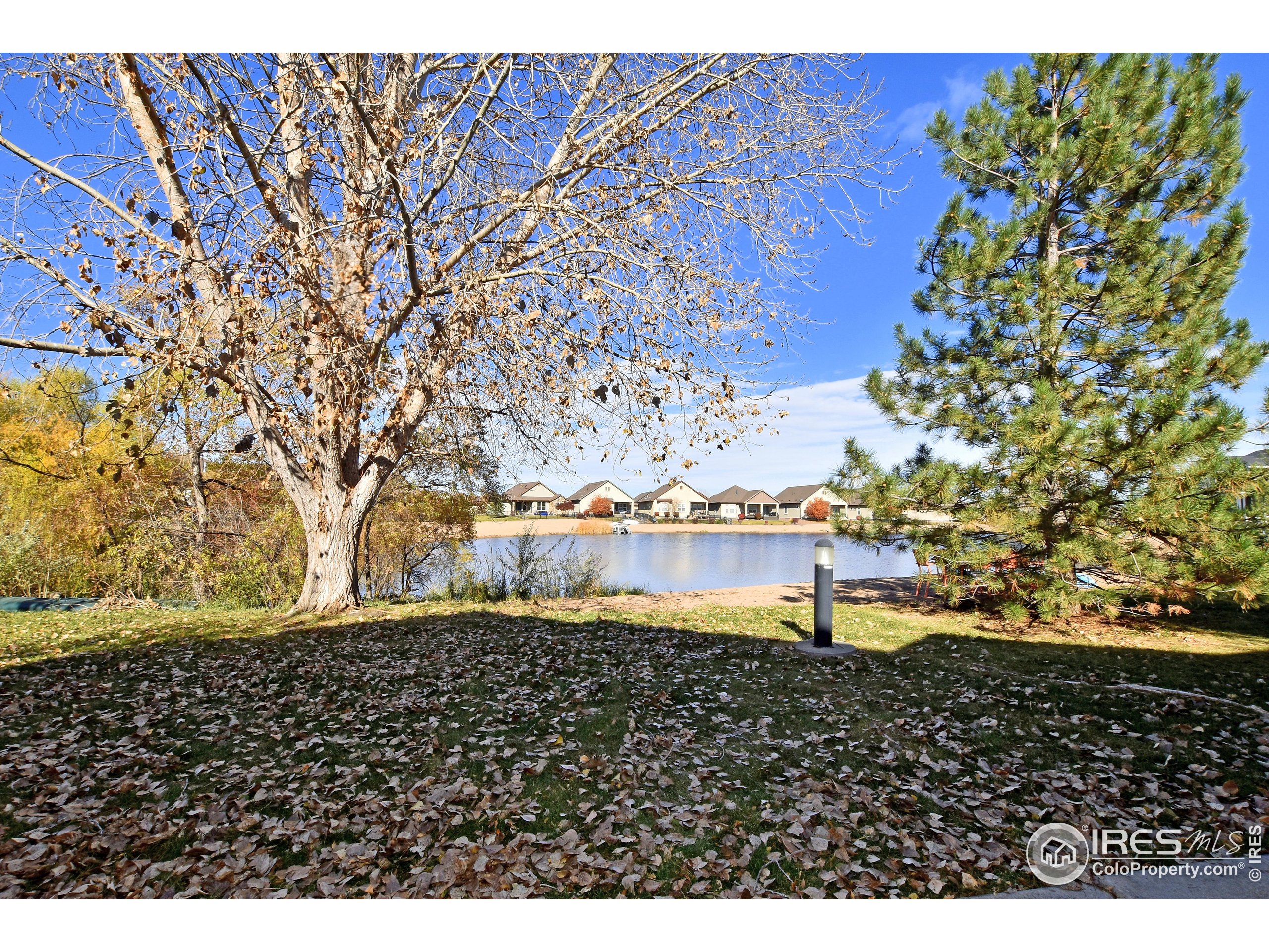 2172 Cape Hatteras Drive, Unit 2 Windsor, CO 80550 - Photo 41 of 46 a view of a lake