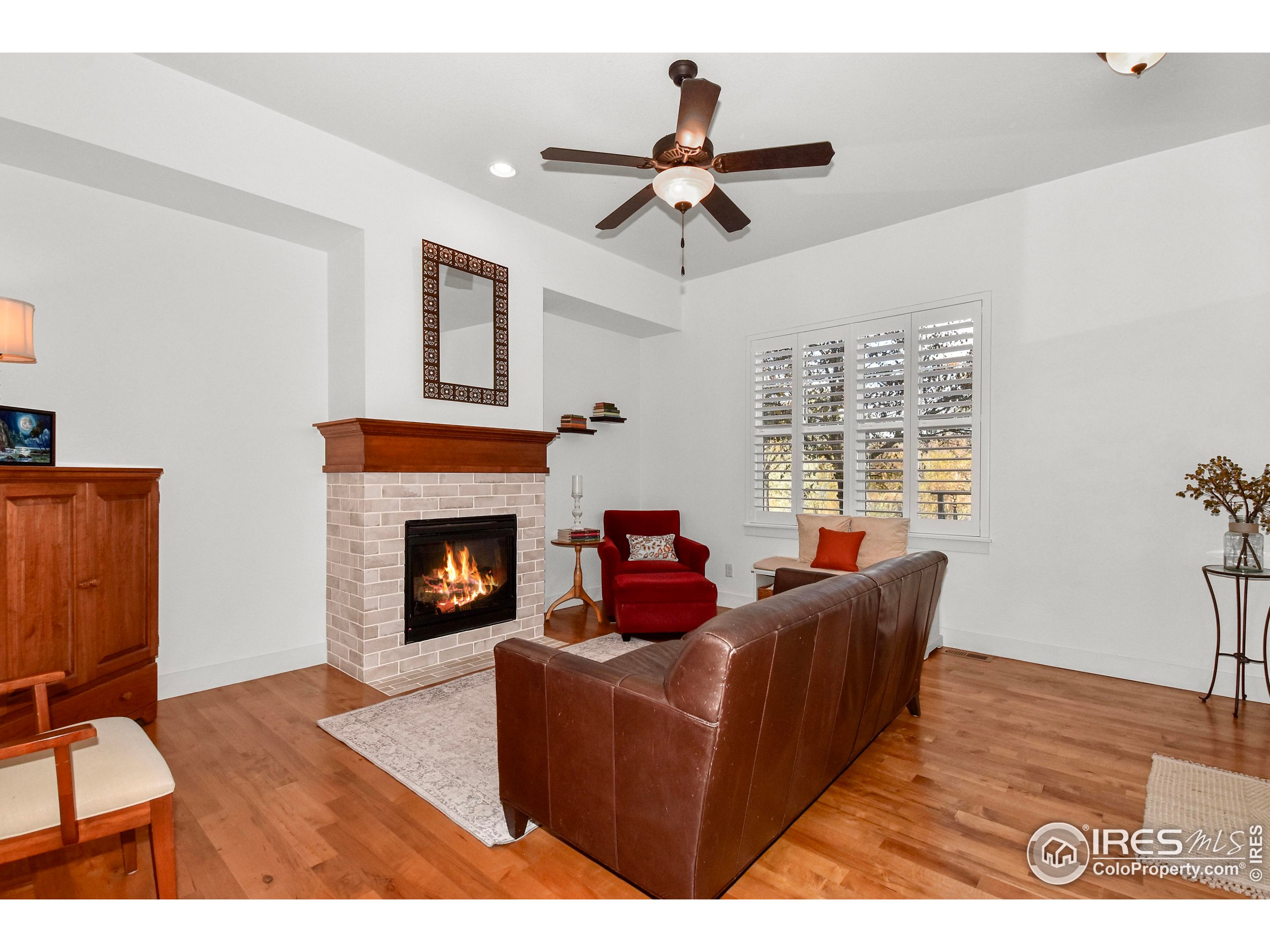 2172 Cape Hatteras Drive, Unit 2 Windsor, CO 80550 - Photo 6 of 46 a living room with furniture and a fireplace