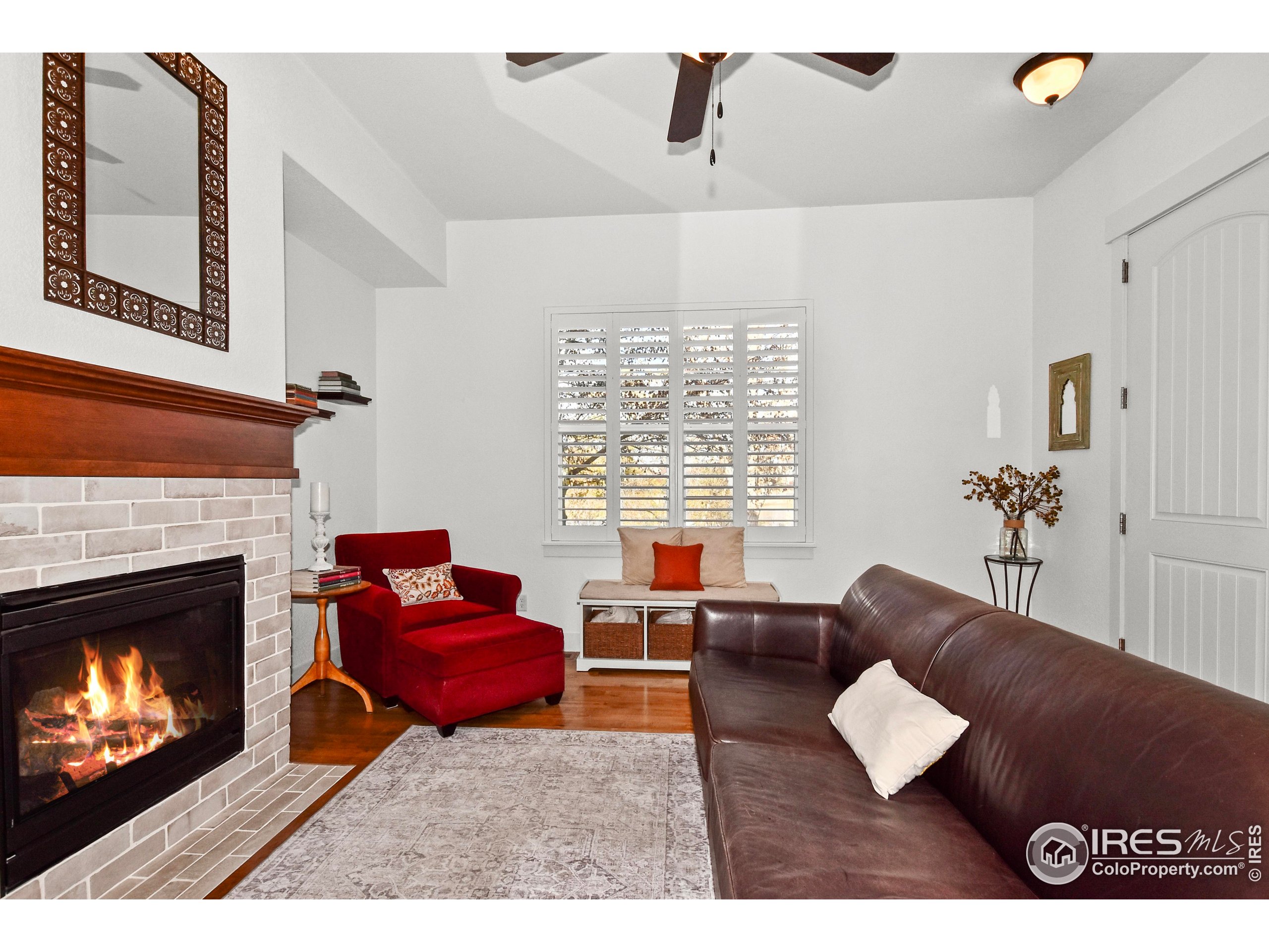 2172 Cape Hatteras Drive, Unit 2 Windsor, CO 80550 - Photo 7 of 46 a living room with furniture and a fireplace