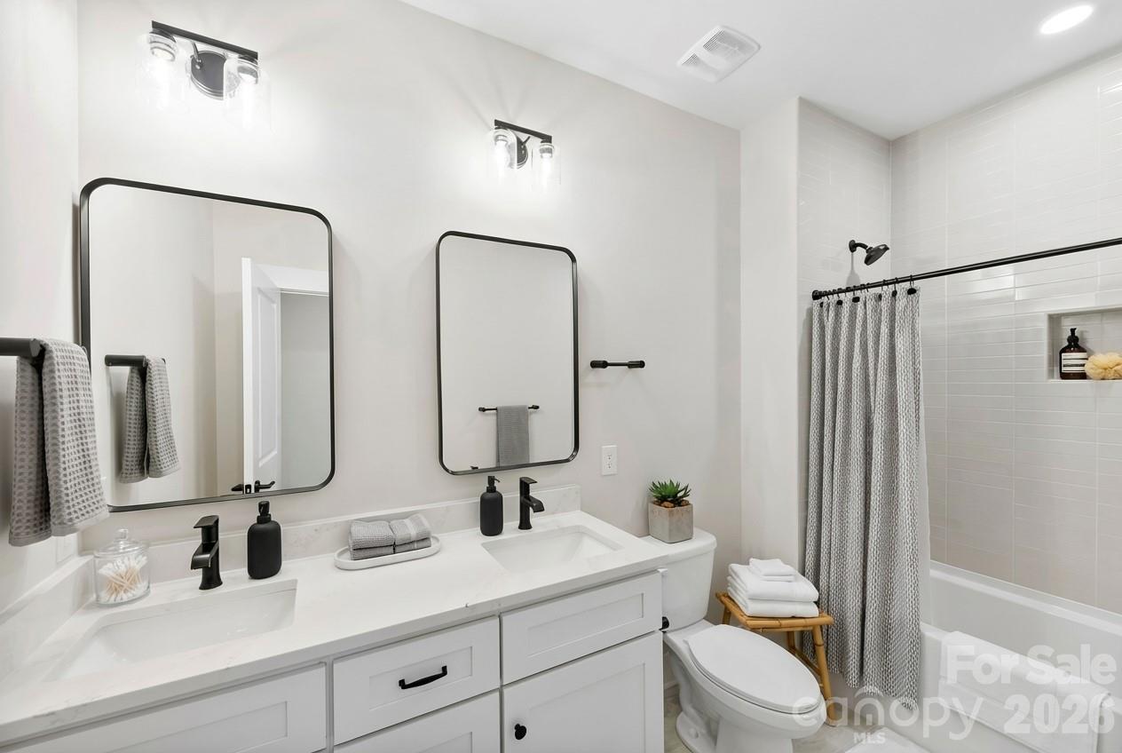 551 Perry Road Troutman, NC 28166 - Photo 31 of 47 a bathroom with 2 sink toilet and shower