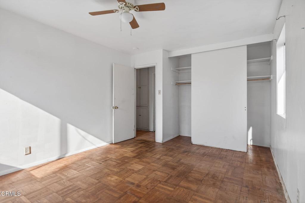 236 East Poplar Street Oxnard, CA 93033 - Photo 13 of 20 a view of a big room with closet and chandelier fan