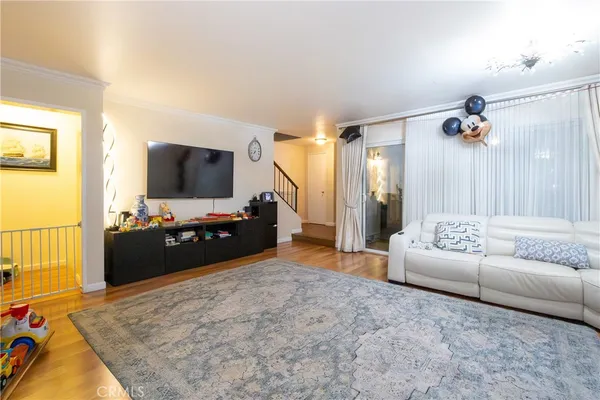 a living room with furniture and a flat screen tv