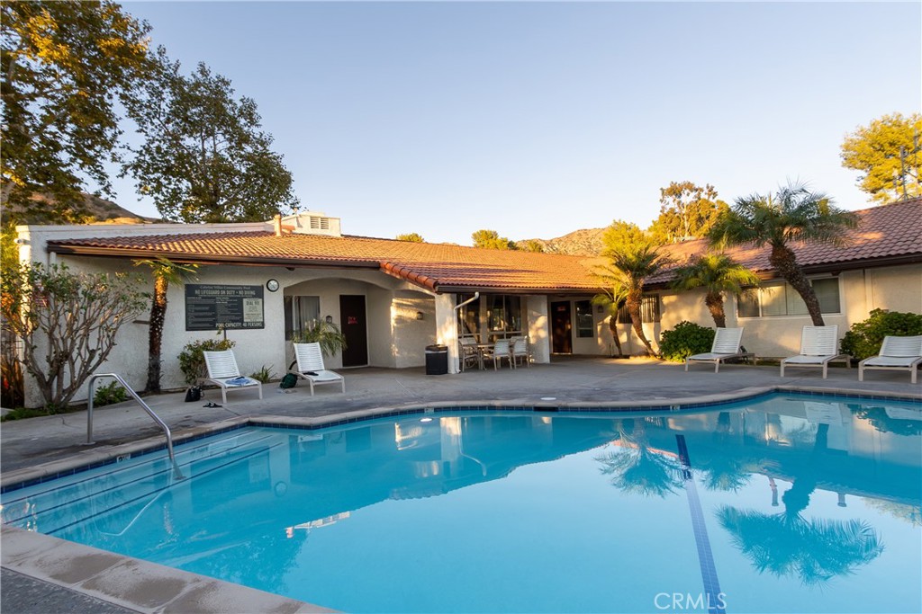 9551 Vía Ricardo Burbank, CA 91504 - Photo 26 of 29 a view of a house with swimming pool and sitting area