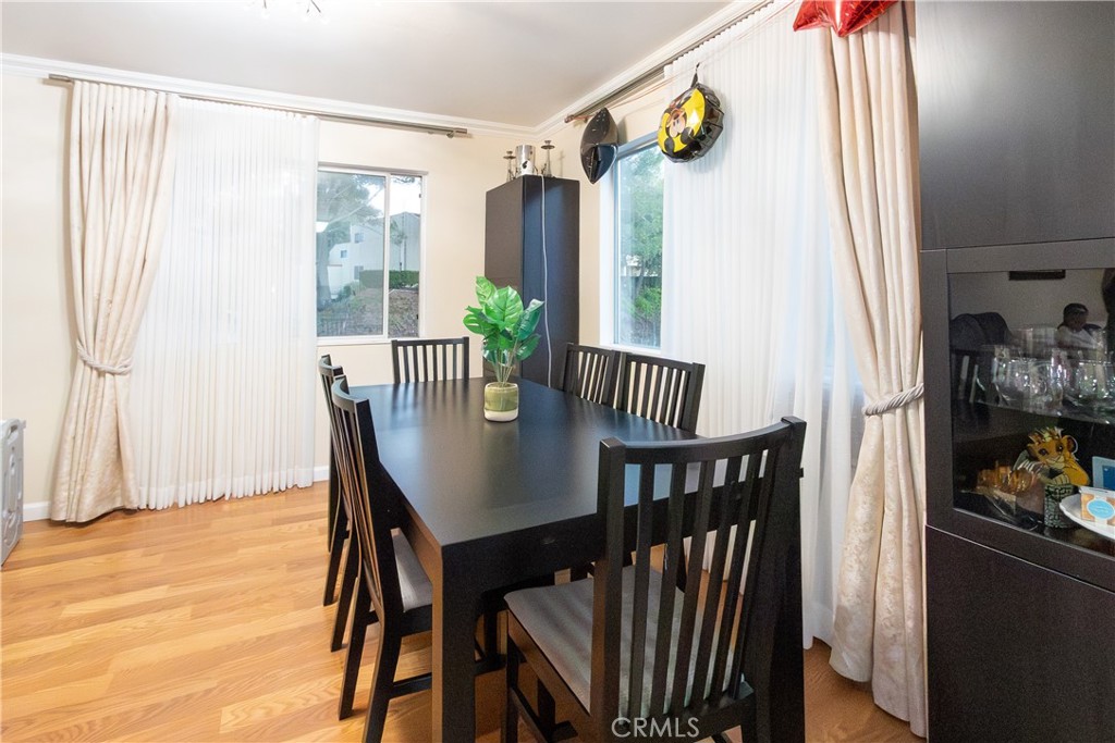 9551 Vía Ricardo Burbank, CA 91504 - Photo 5 of 29 a view of a dining room with furniture window and wooden floor