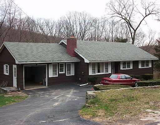9 Valleyview Road Danbury, CT 06811 - Photo 1 of 1 a front view of a house with a yard