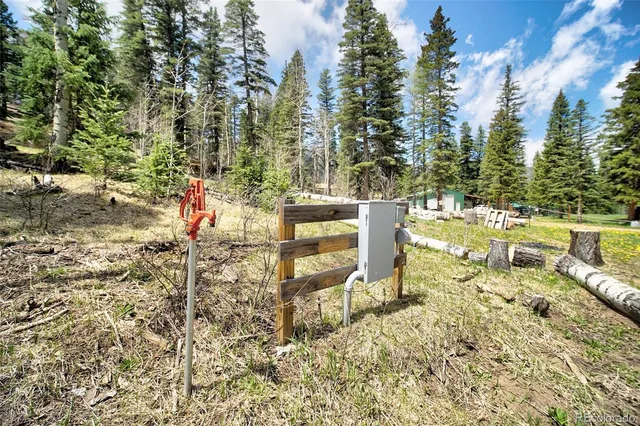 a view of house with swimming pool