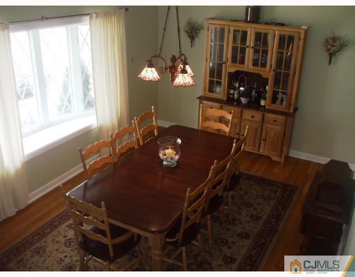 81 Westminster Road Colonia, NJ 07067 - Photo 4 of 9 a view of a dining room with furniture and window
