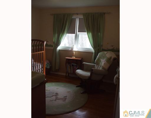 81 Westminster Road Colonia, NJ 07067 - Photo 7 of 9 a living room with furniture and a window