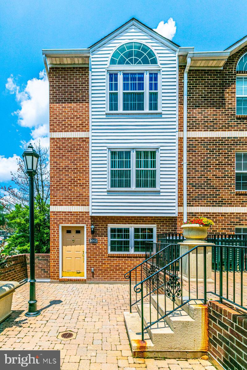a front view of a house with a patio