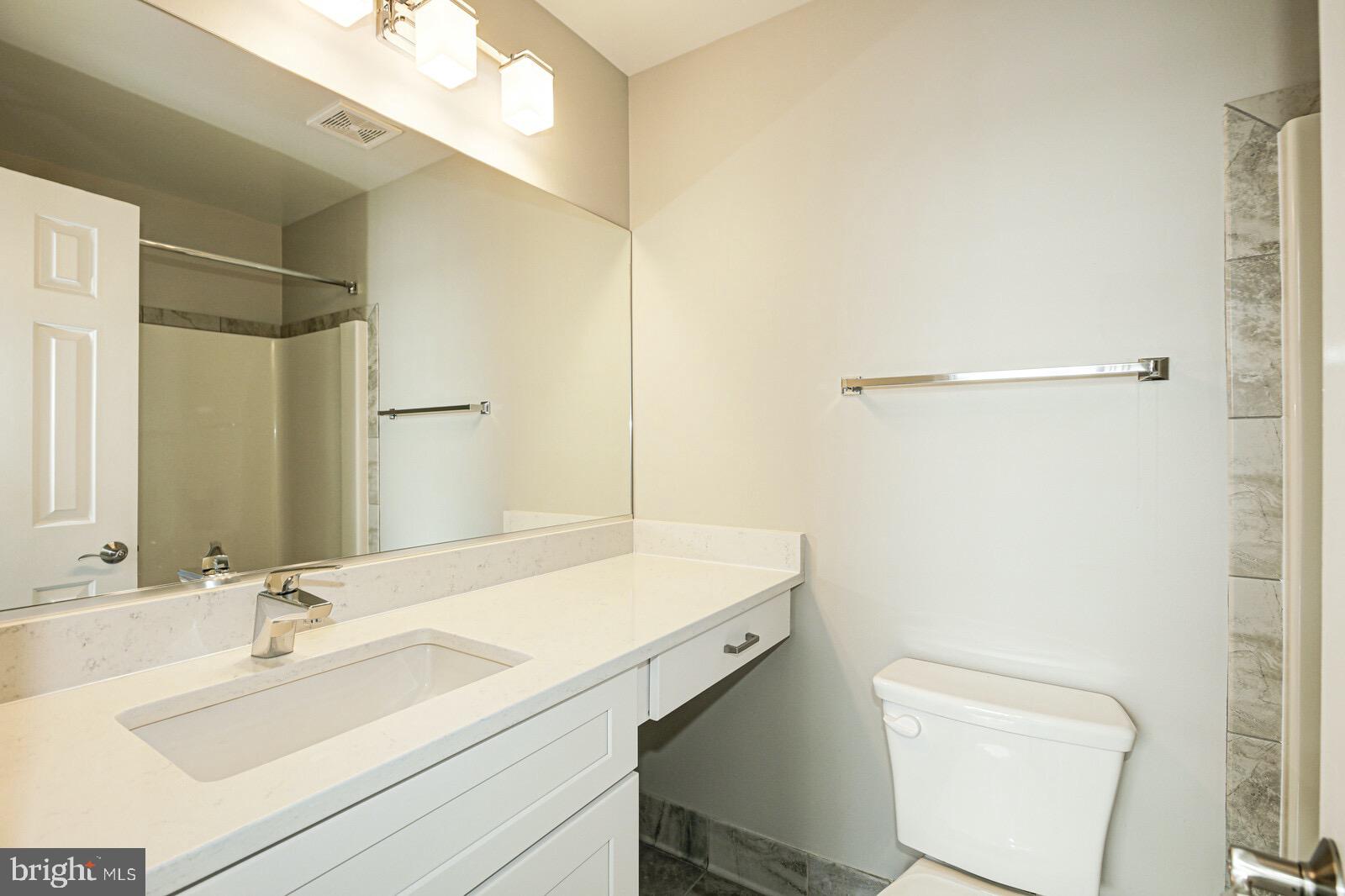 3002 South Glebe Road Arlington, VA 22206 - Photo 12 of 31 a bathroom with a sink toilet and shower