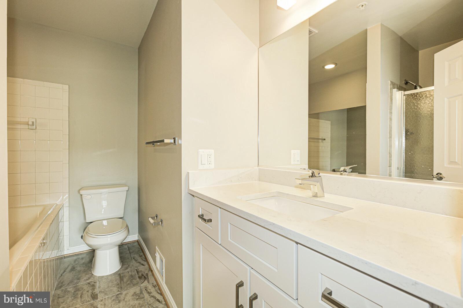 3002 South Glebe Road Arlington, VA 22206 - Photo 16 of 31 a bathroom with a sink toilet and shower
