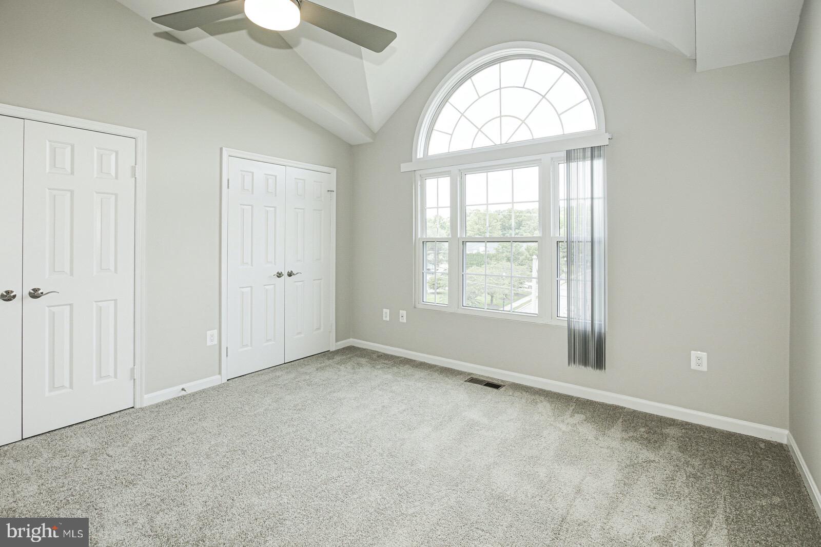 3002 South Glebe Road Arlington, VA 22206 - Photo 20 of 31 an empty room with windows mirror and windows