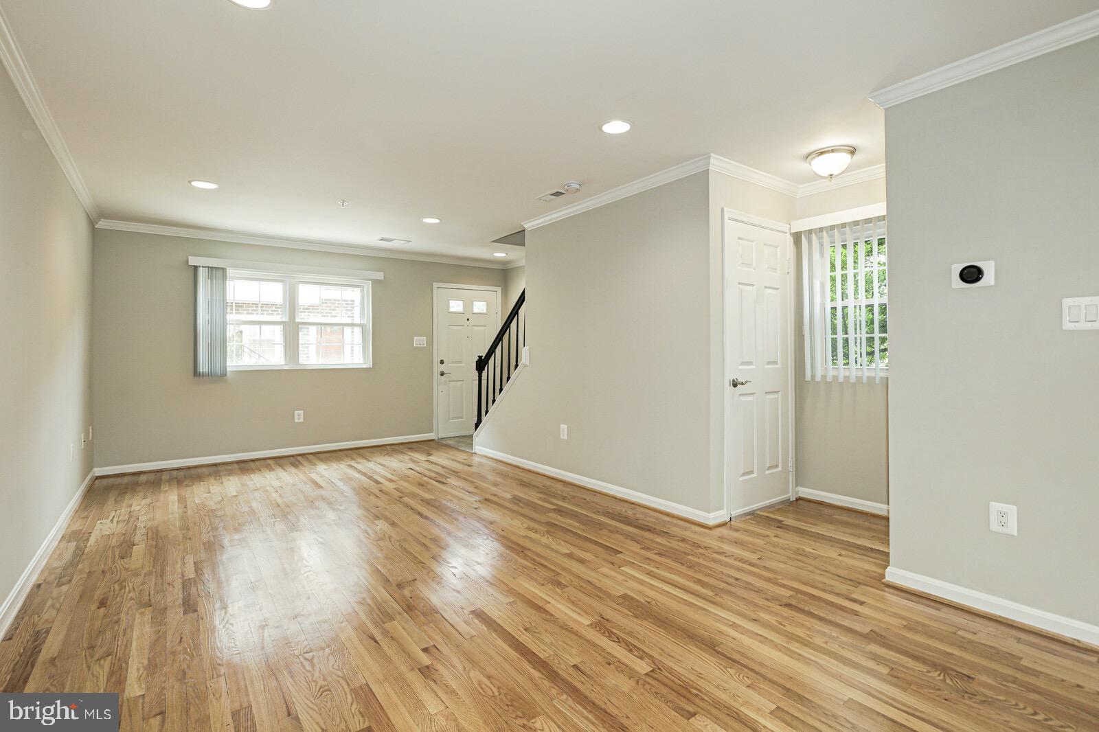 3002 South Glebe Road Arlington, VA 22206 - Photo 4 of 31 an empty room with wooden floor and windows