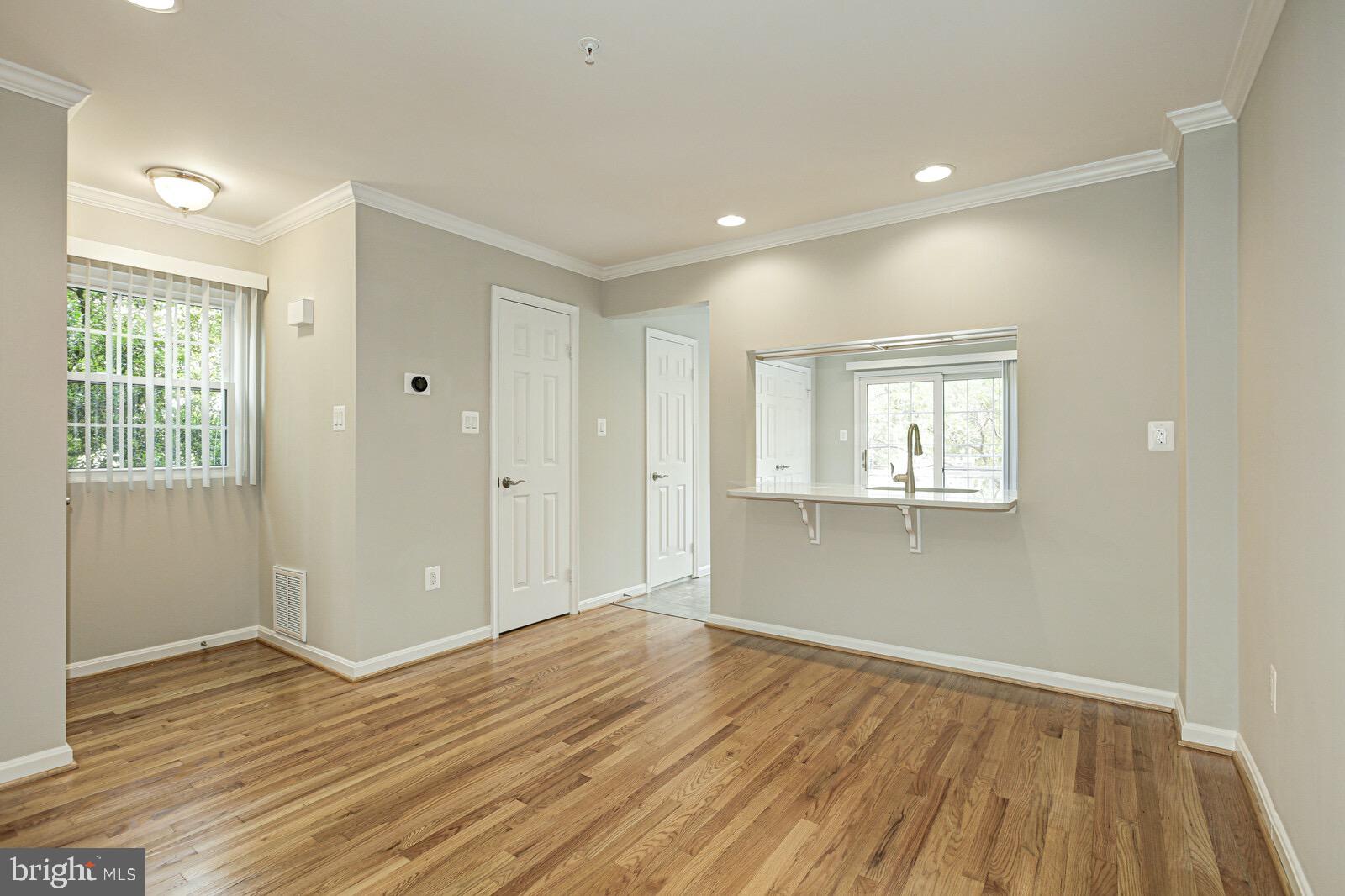 3002 South Glebe Road Arlington, VA 22206 - Photo 5 of 31 a view of a room with wooden floor and window