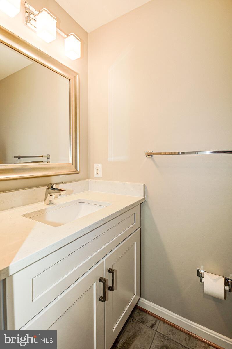 3002 South Glebe Road Arlington, VA 22206 - Photo 10 of 31 a bathroom with a sink and a mirror