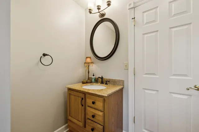 a kitchen with stainless steel appliances granite countertop a stove refrigerator sink and cabinets