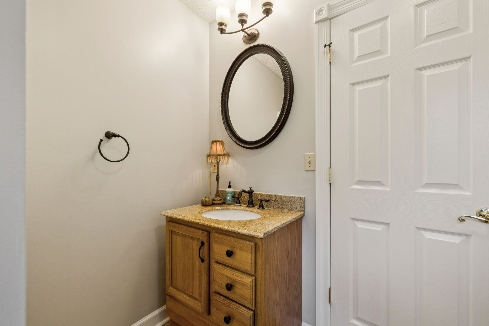 106 Highland Street Hohenwald, TN 38462 - Photo 13 of 85 a bathroom with a sink and a mirror