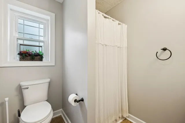 a kitchen with a refrigerator and a stove top oven