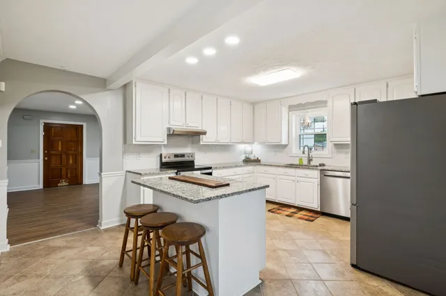 a view of a hallway with a white walls