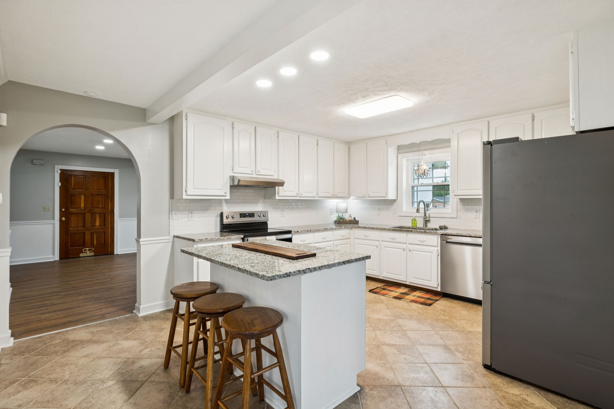 106 Highland Street Hohenwald, TN 38462 - Photo 18 of 85 a kitchen with stainless steel appliances granite countertop a stove refrigerator sink and cabinets