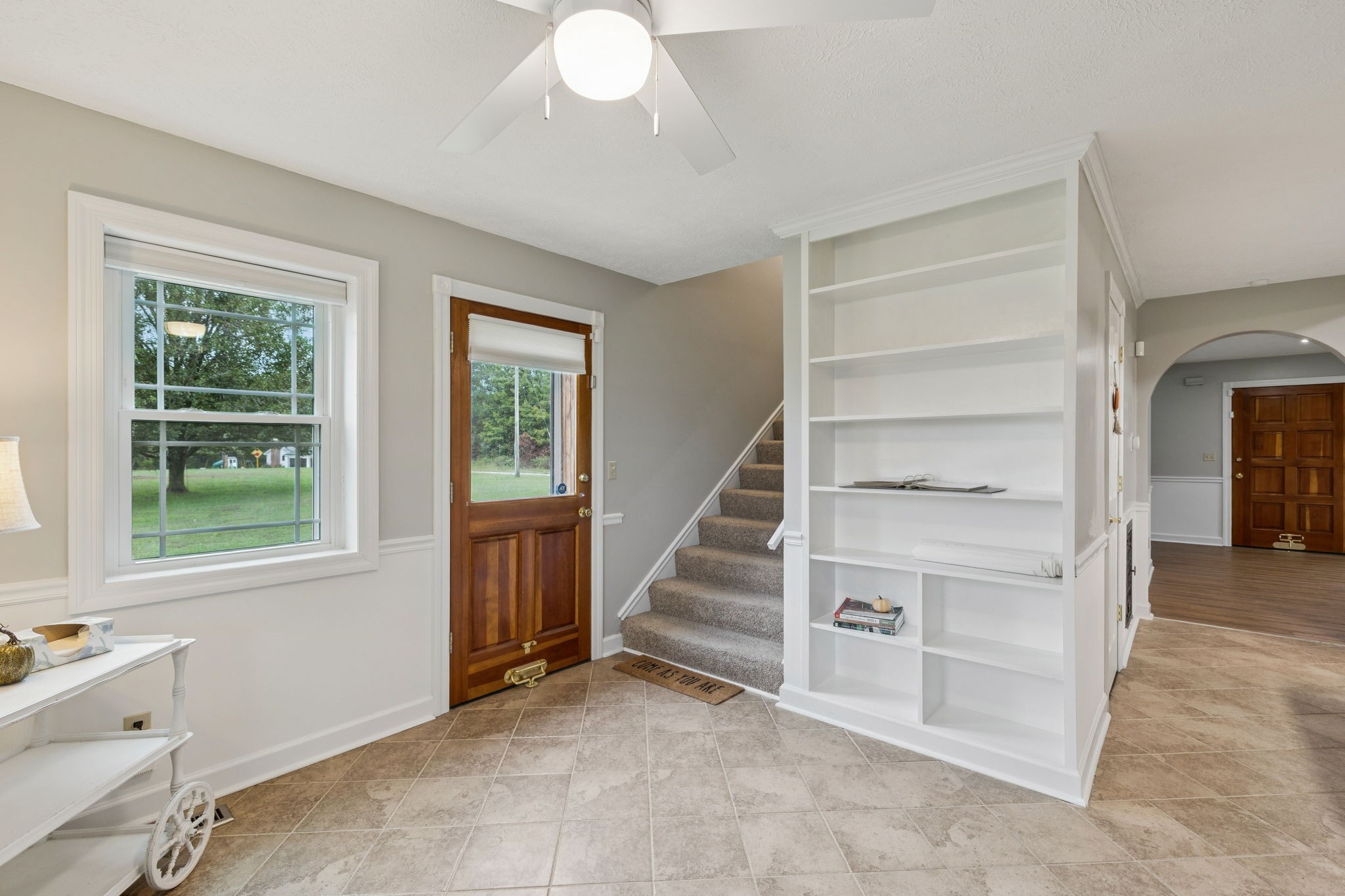106 Highland Street Hohenwald, TN 38462 - Photo 25 of 85 a view of an empty room with stairs and a window