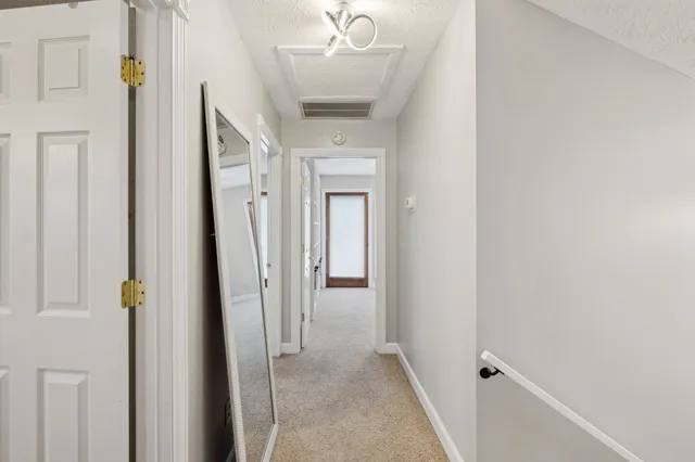 a view of an empty room with a sliding door