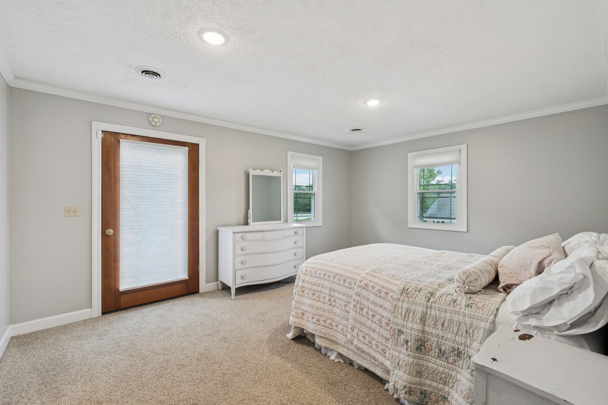 106 Highland Street Hohenwald, TN 38462 - Photo 28 of 85 a bedroom with a bed and a couch