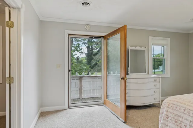 a view of a house with swimming pool and sitting area