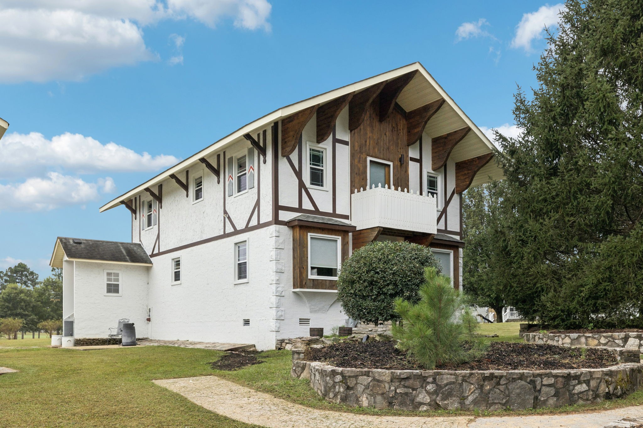 106 Highland Street Hohenwald, TN 38462 - Photo 49 of 85 a front view of a house with garden