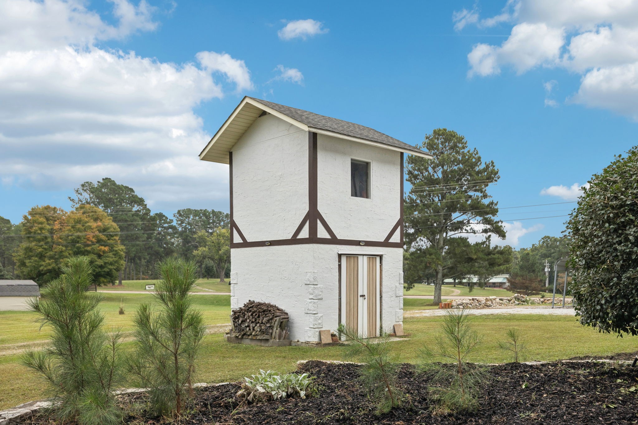 106 Highland Street Hohenwald, TN 38462 - Photo 53 of 85 a view of a house with a yard