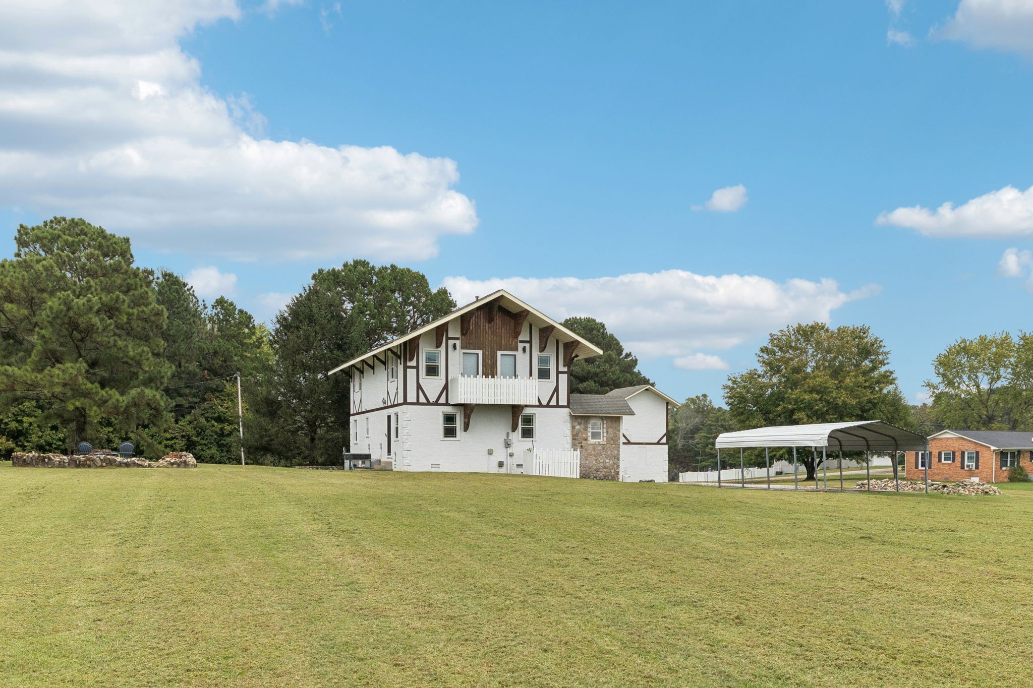 106 Highland Street Hohenwald, TN 38462 - Photo 56 of 85 a view of a house with a yard