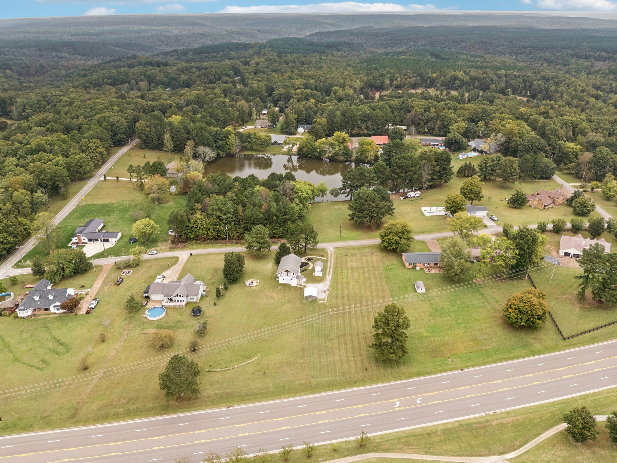 106 Highland Street Hohenwald, TN 38462 - Photo 71 of 85 an aerial view of residential houses with outdoor space