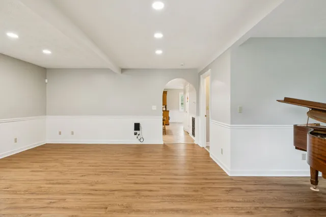 a white toilet sitting next to a window
