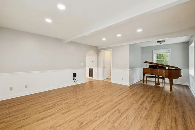 a kitchen with granite countertop cabinets and refrigerator