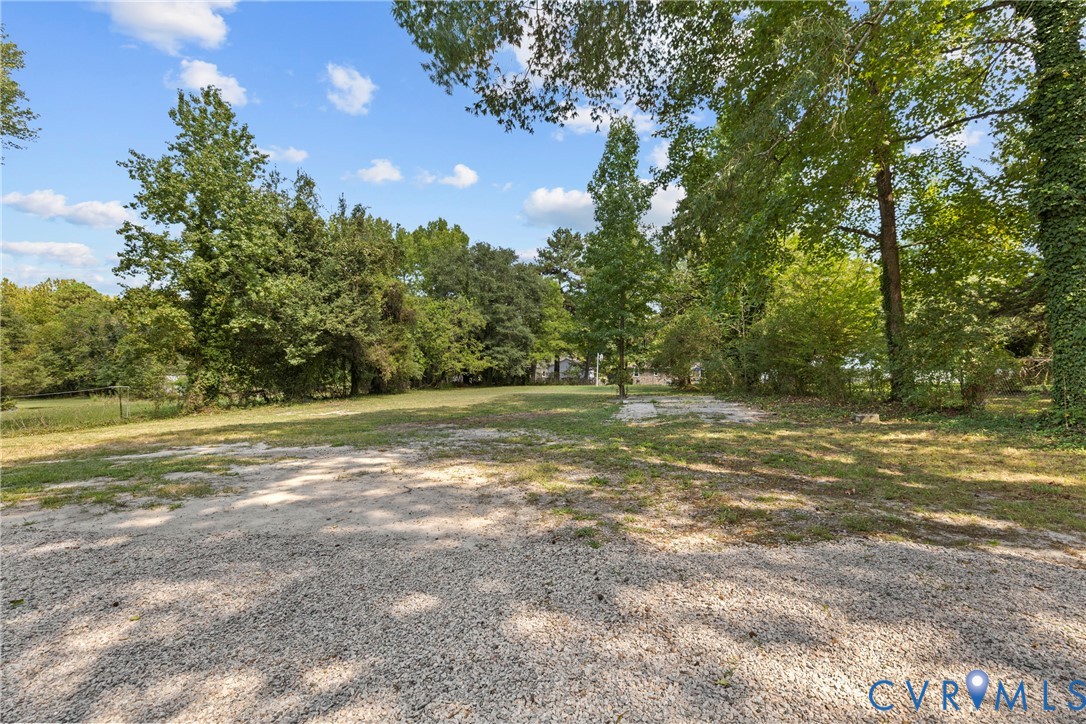 821 Fort Lee Road Petersburg, VA 23803 - Photo 37 of 45 Gravel surface area with a surrounding grass lawn