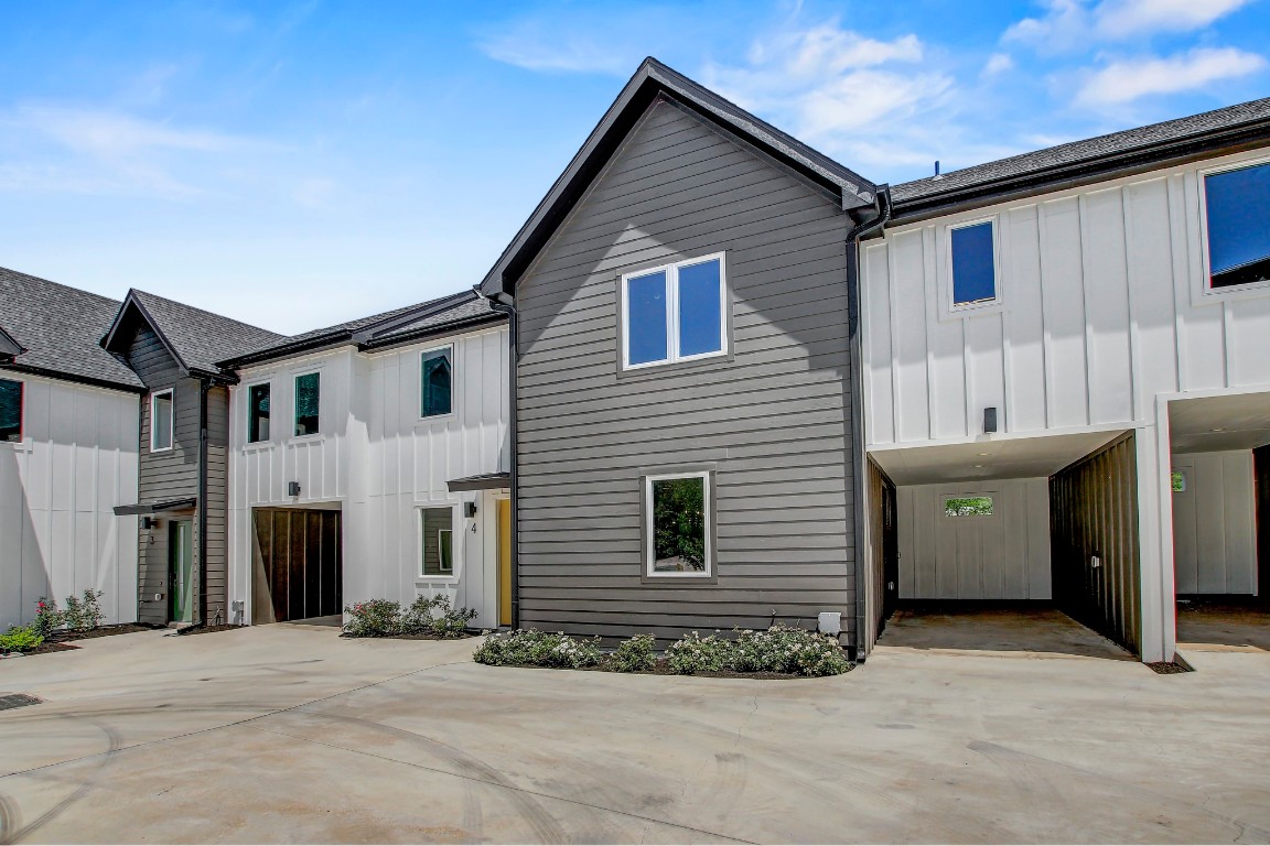 4127 East 12th Street, Unit 4 Austin, TX 78721 - Photo 28 of 32 View of front of home with board and batten siding and roof with shingles