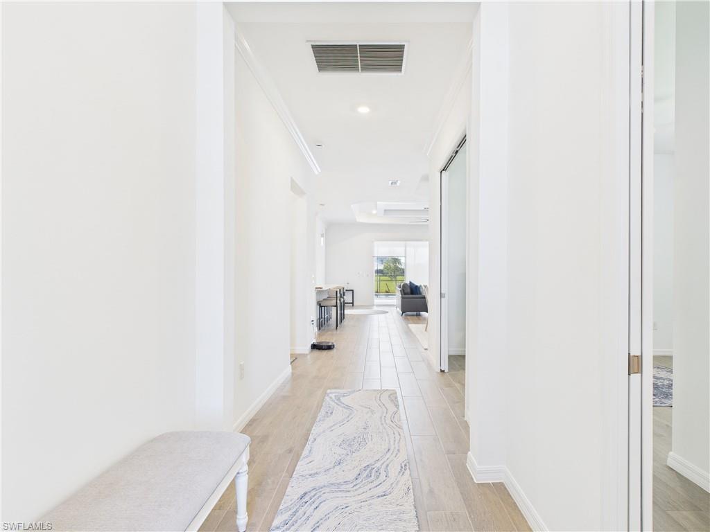 5412 Fancourt Links Way Ave Maria, FL 34142 - Photo 23 of 39 Corridor with light wood-style flooring and recessed lighting