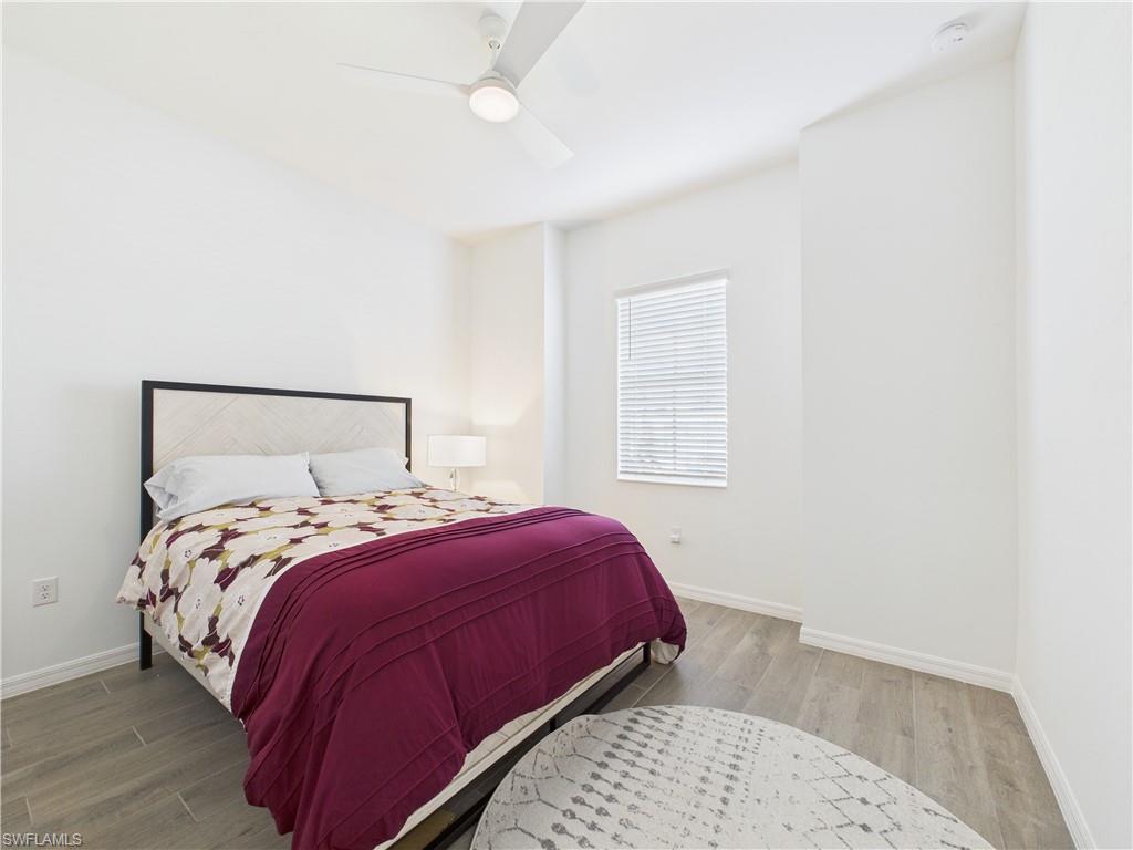 5412 Fancourt Links Way Ave Maria, FL 34142 - Photo 29 of 39 Bedroom featuring wood finished floors and ceiling fan