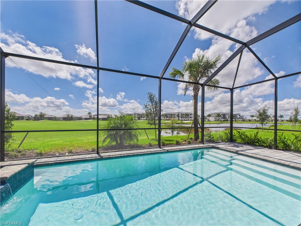 5412 Fancourt Links Way Ave Maria, FL 34142 - Photo 33 of 39 Outdoor pool with a sunroom, a water and golf course views