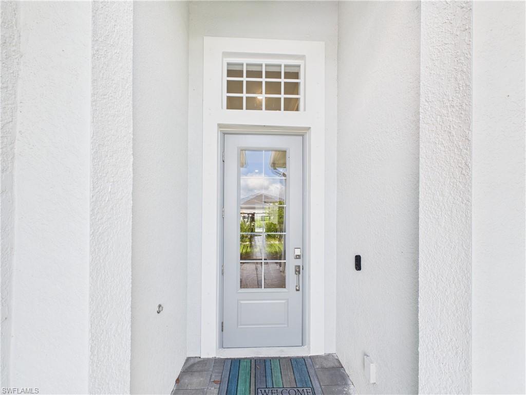 5412 Fancourt Links Way Ave Maria, FL 34142 - Photo 34 of 39 Property entrance with stucco siding
