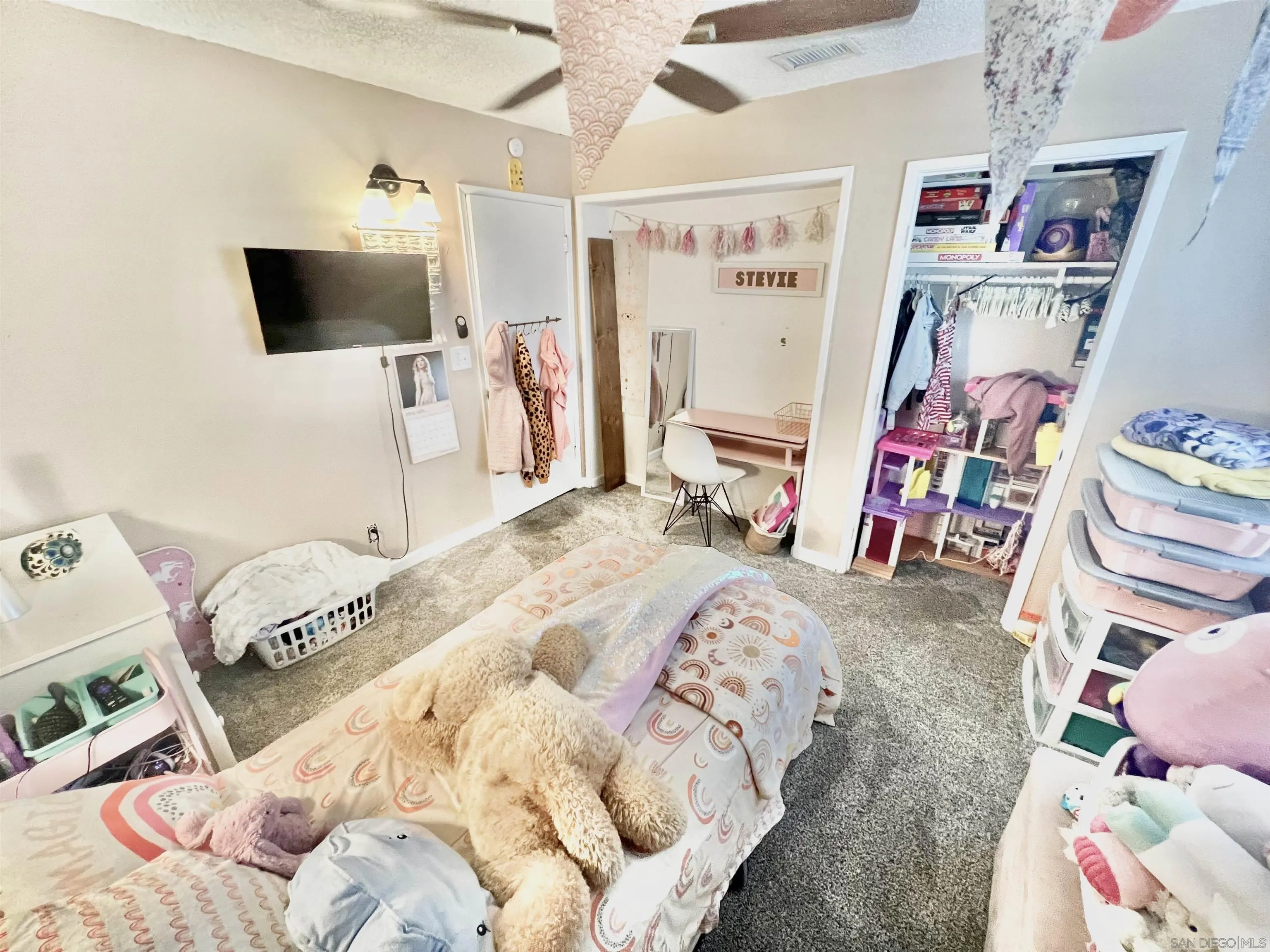 1663 Buckeye Drive El Cajon, CA 92021 - Photo 14 of 20 a bedroom with a bed and a flat screen tv