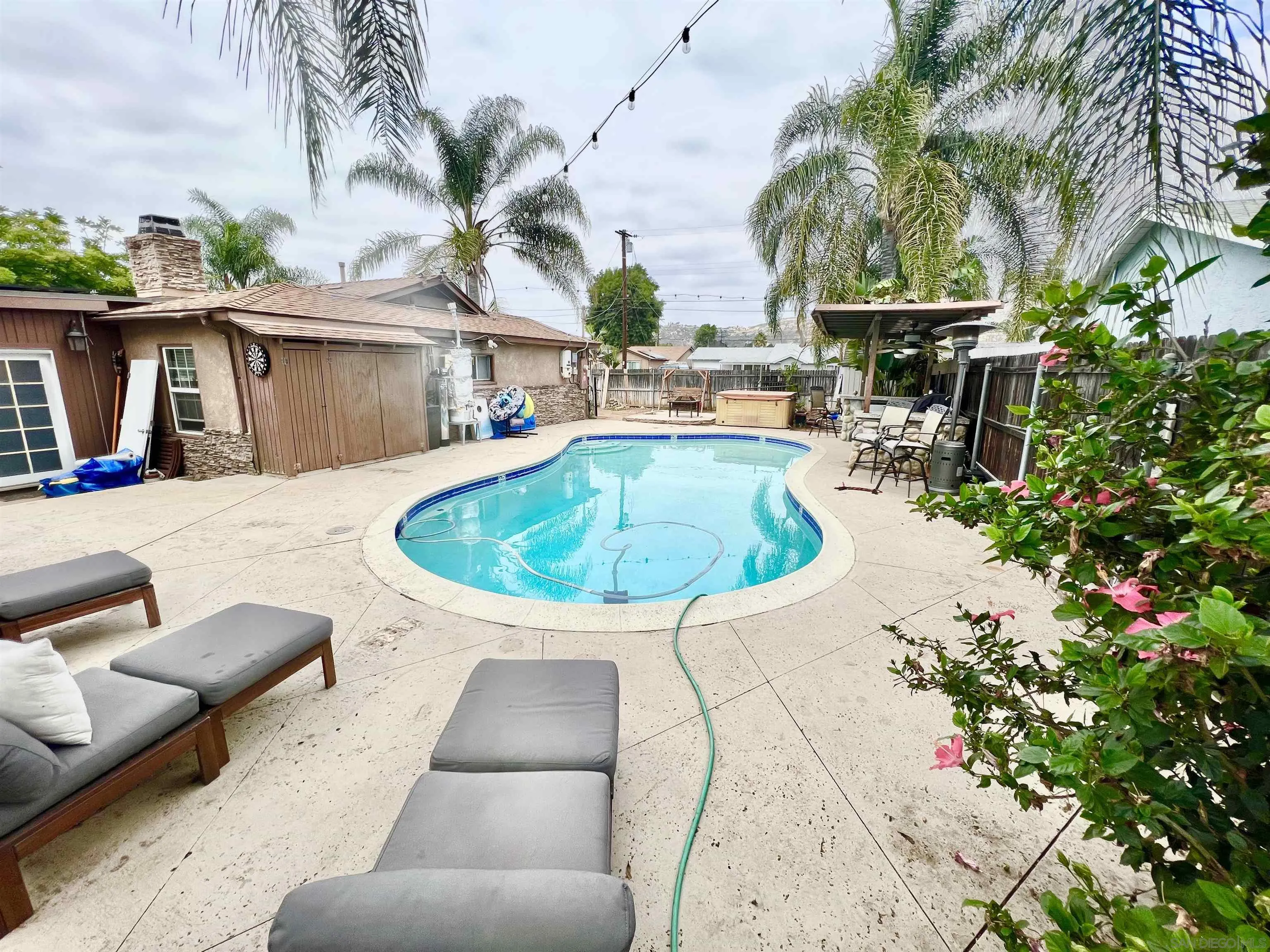 1663 Buckeye Drive El Cajon, CA 92021 - Photo 17 of 20 a swimming pool with outdoor seating yard and barbeque oven