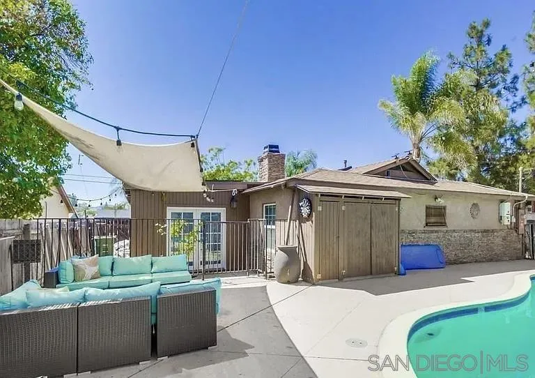 1663 Buckeye Drive El Cajon, CA 92021 - Photo 18 of 20 a front view of a house with a yard garage and outdoor seating