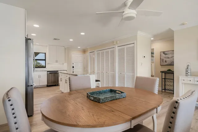a dining room with furniture a rug and wooden floor