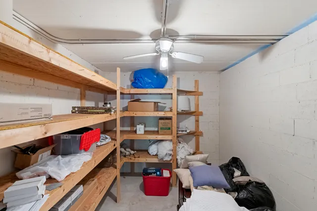 a view of an house with swimming pool and chairs