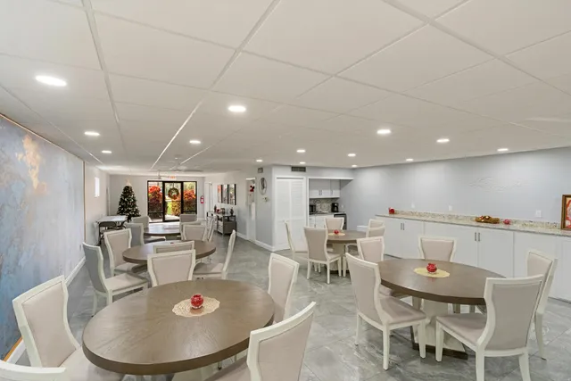 a view of a terrace with wooden floor and outdoor seating